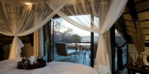 Etosha accommodation at an Okaukuejo waterhole chalet