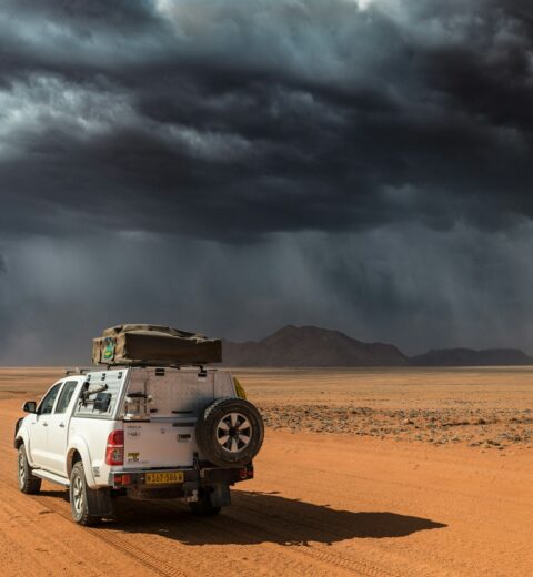 Vehicle on a northern Namibia road approaching King Nehale Gate