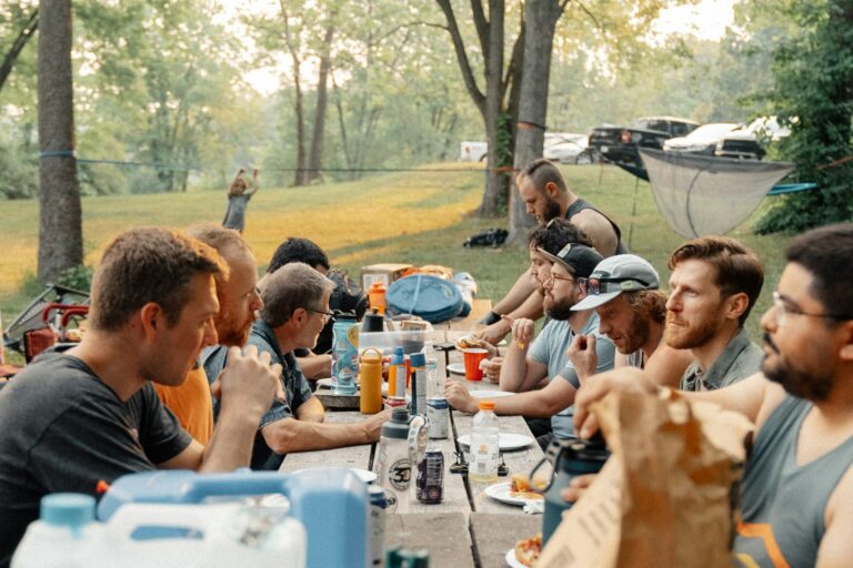 Etosha dinner after game drive represented by travellers sharing a simple outdoor campsite meal