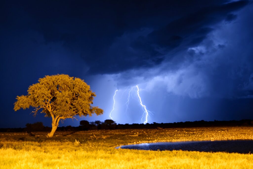 Lightning during a thunderstorm over an Etosha waterhole